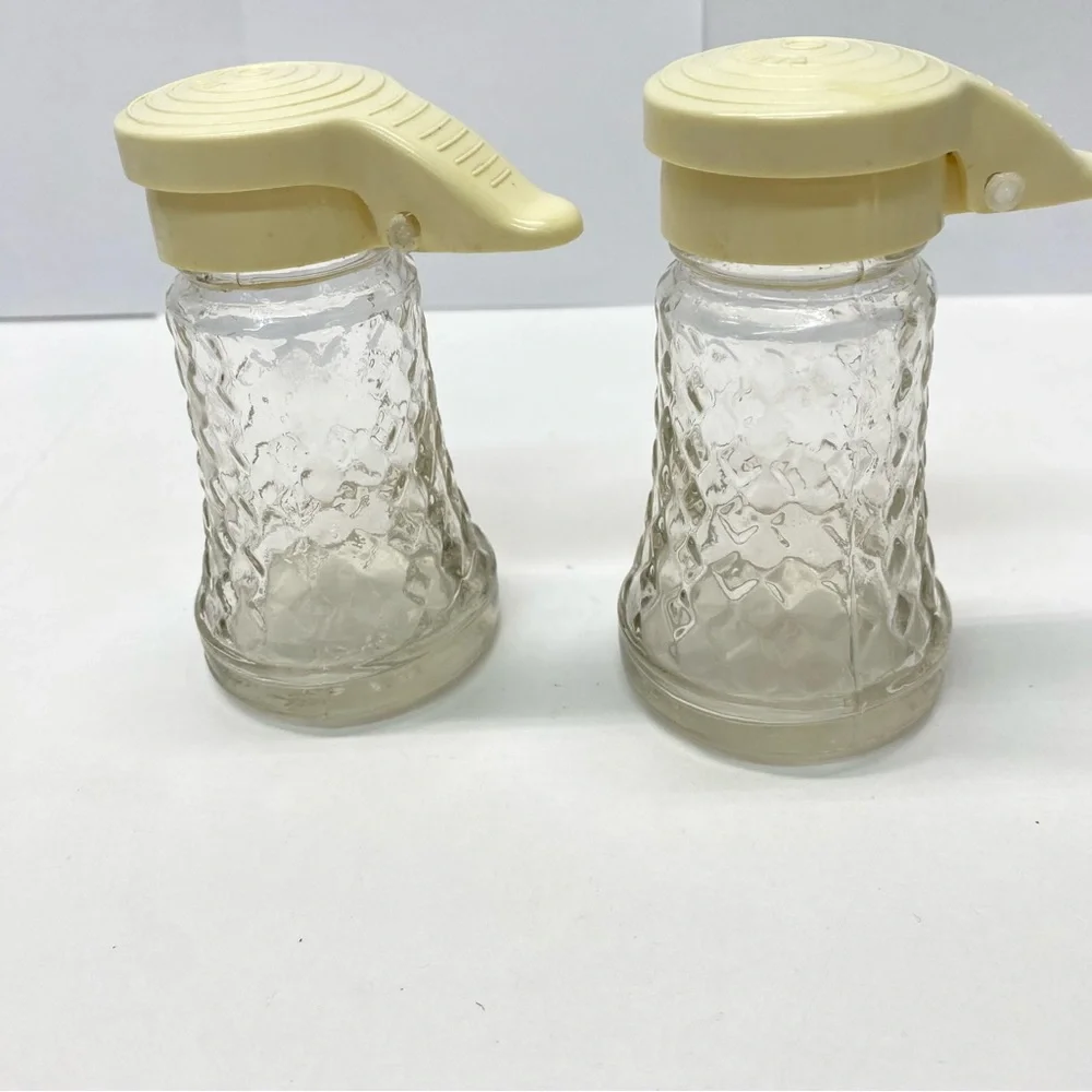 Vintage Daniells Salt and Pepper Shakers Set Beige Top Glass Bottom Plastic Tops